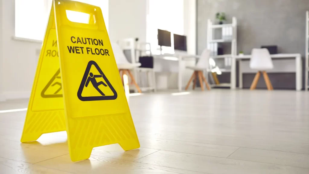 Yellow caution wet floor sign in office