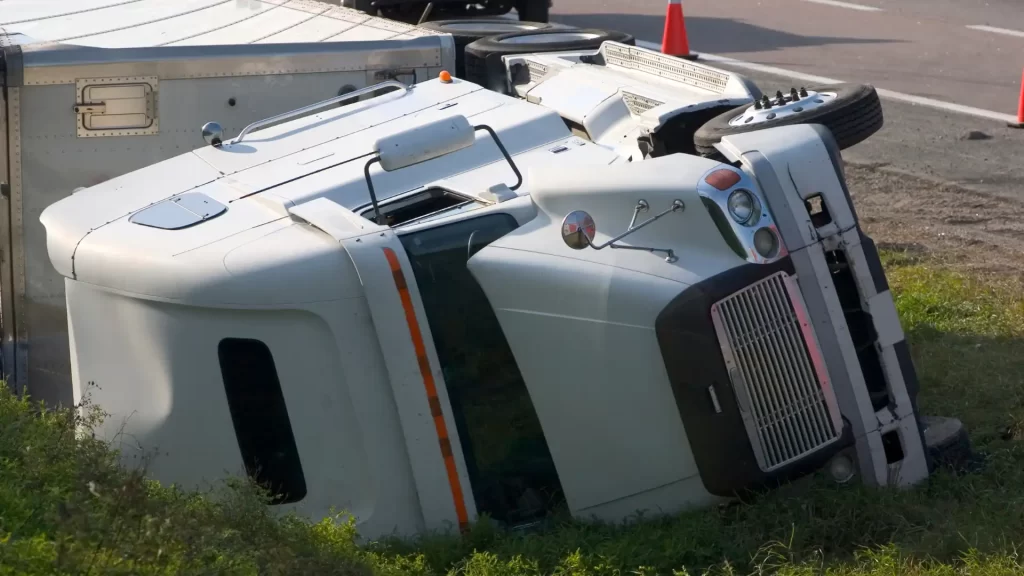 Overturned semi-truck lying on its side after accident